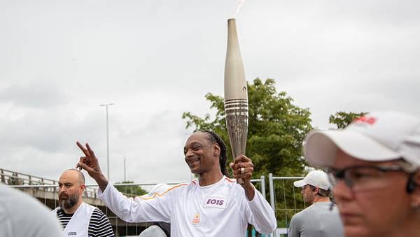 Snoop Lights Up... Paris with Olympic Torch in Hand