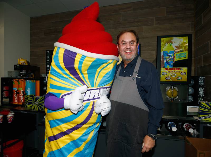 Texas Motor Speedway President Eddie Gossage serves free Slurpees to fans at Texas Motor Speedway (Photo by Matt Sullivan/Getty Images)