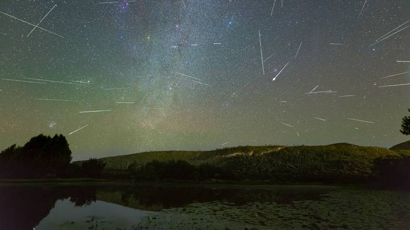 A breathtaking view of Perseids meteor shower over the pond